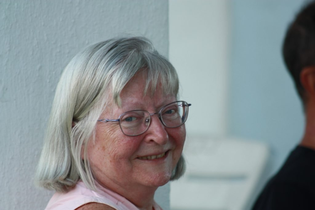 Joan, owner of The Book Press, smiling